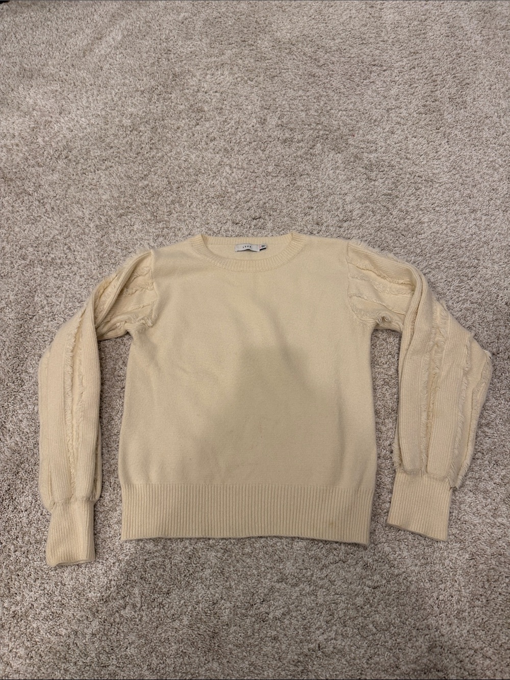 Cream sweater with detailed sleeves. Size S. Good condition.